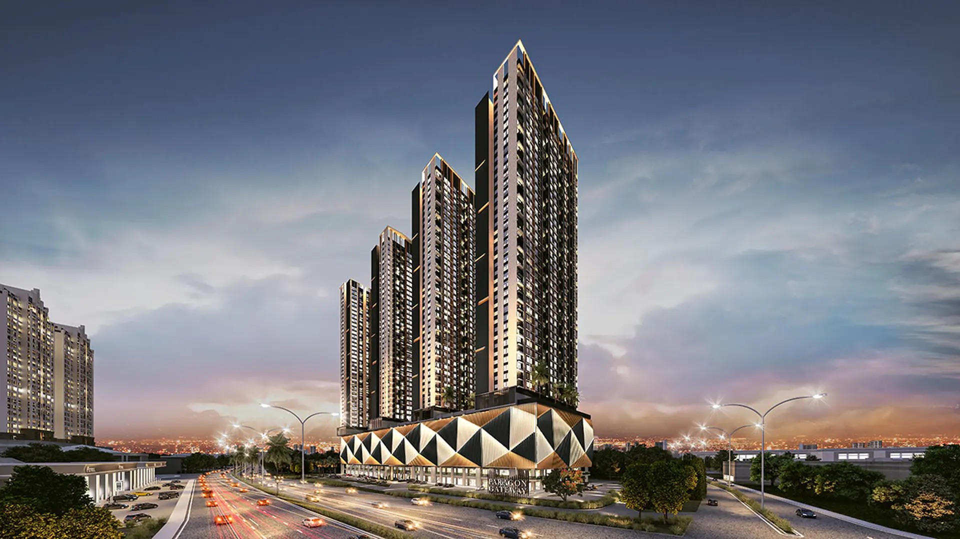 Paragon Gateway's four cascading towers at twilight above a geometric gold and charcoal retail podium, Johor Bahru highway in foreground